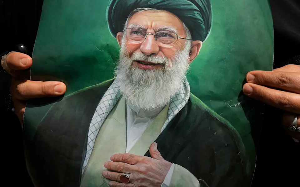 A poster of the late Ayatollah Ali Khamenei at the funeral ceremonies for him and his family at the Imam Khomeini Mosalla Grand Mosque