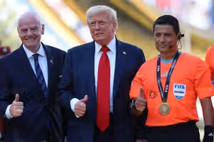 Thumbs up: Iranian football referee's pose alongside Trump stokes ire