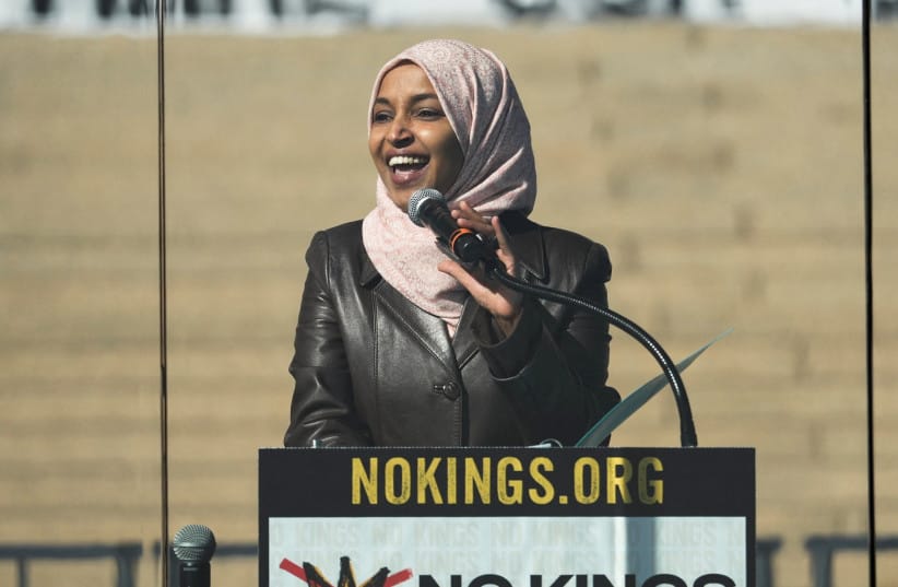 US Rep. Ilhan Omar (D-MN) speaks behind a glass during a ''No Kings'' protest against U.S. President Donald Trump's administration policies, in St. Paul, Minnesota, March 28, 2026.