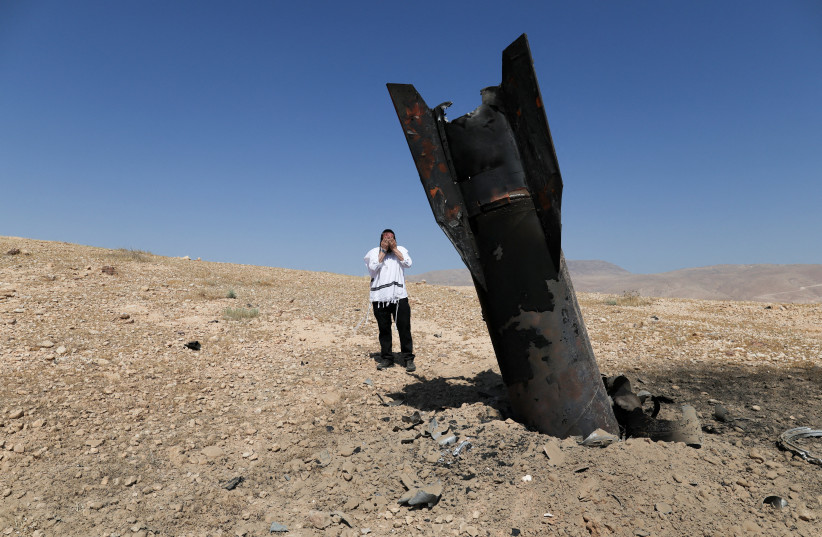 Part of an Iranian ballistic missile is seen in the desert near Vered Yeriho in the West Bank after being fired toward Israel from Iran, June 8, 2026.