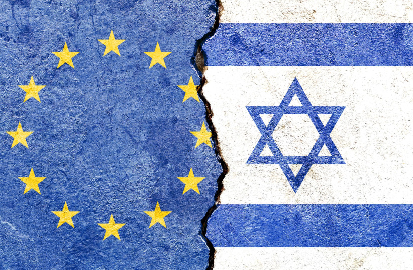 An illustrative image of Israeli and the European Union flags with a division between them.