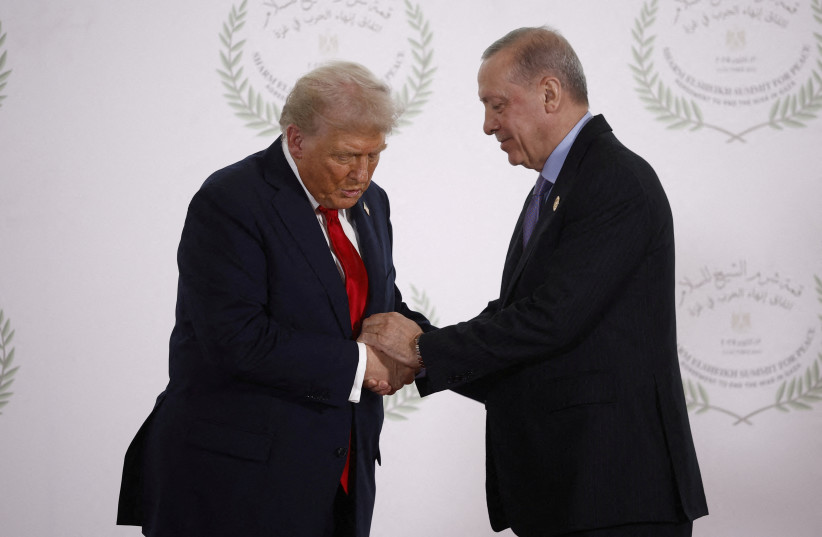 US President Donald Trump and Turkish President Recep Tayyip Erdogan shake hands as they pose for a photo at a world leaders' summit in Sharm el-Sheikh, Egypt, October 13, 2025
