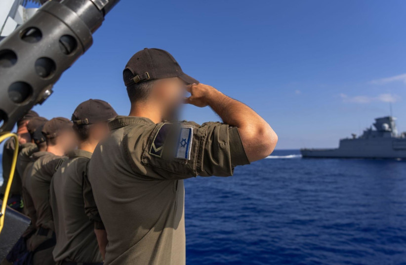 Israel Navy soldiers salute as a German Navy vessel sails past during a visit to Haifa Naval Base, published June 25, 2026.