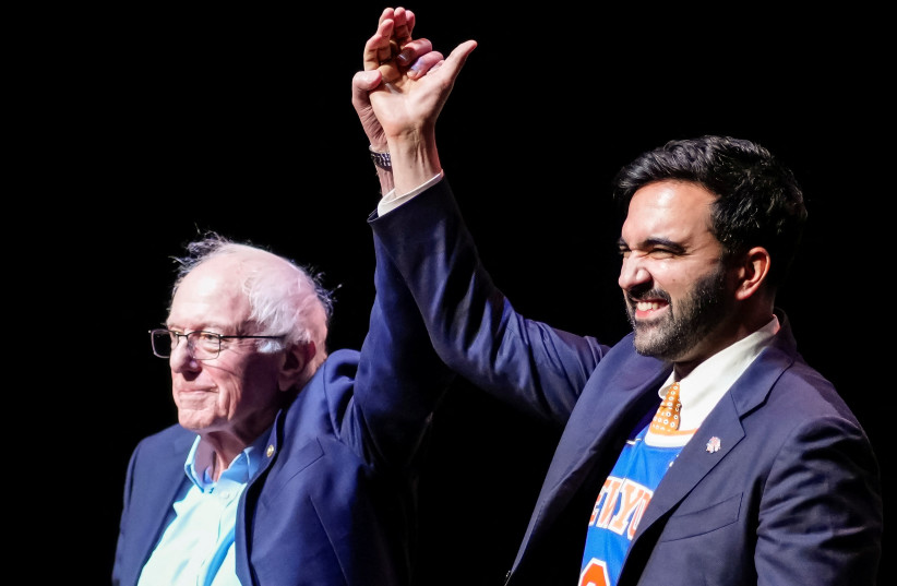 US Senator Bernie Sanders (I-VT) and New York City Mayor Zohran Mamdani hold up hands as they attend the Get Out the Vote rally in Brooklyn, New York, US, June 18, 2026.