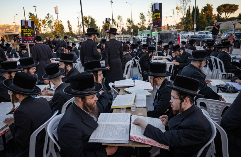 Ultra-Orthodox Jewish men from the Vizhnitz Hasidic dynasty study Torah outside the Justice Ministry in Jerusalem during a silent protest against the imprisonment of yeshiva students who failed to comply with military recruitment orders, July 1, 2026; Illustrative.