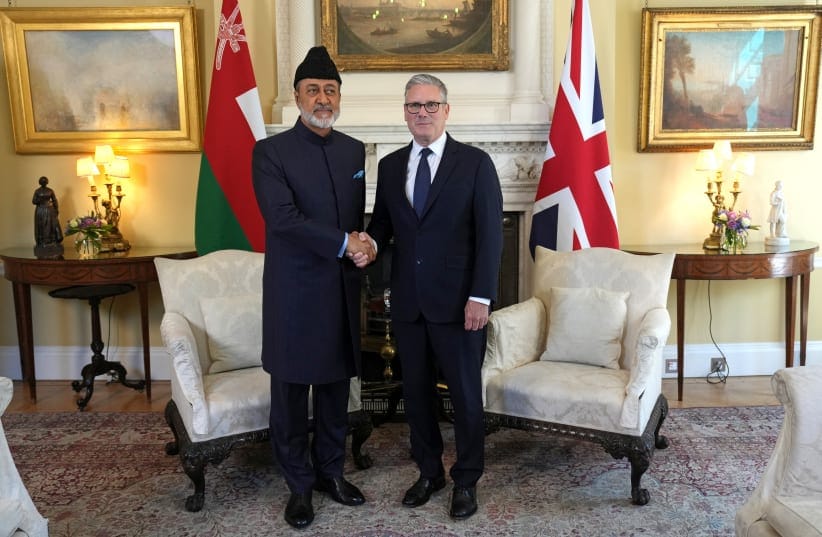 Britain's Prime Minister Keir Starmer shakes hands with Oman's Sultan Haitham bin Tariq during their meeting inside 10 Downing Street, in central London on July 2, 2026.