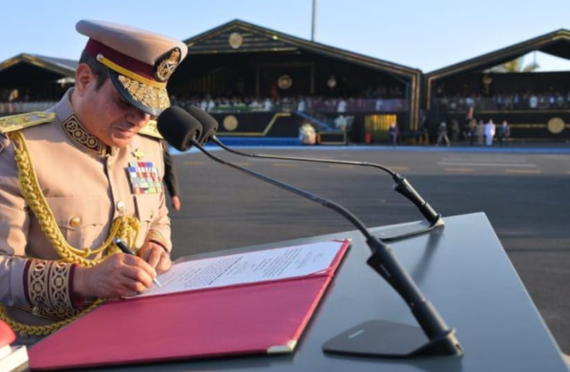Egyptian President Abdel Fattah el-Sisi signs documents at Octagon inauguration, July 5, 2026.