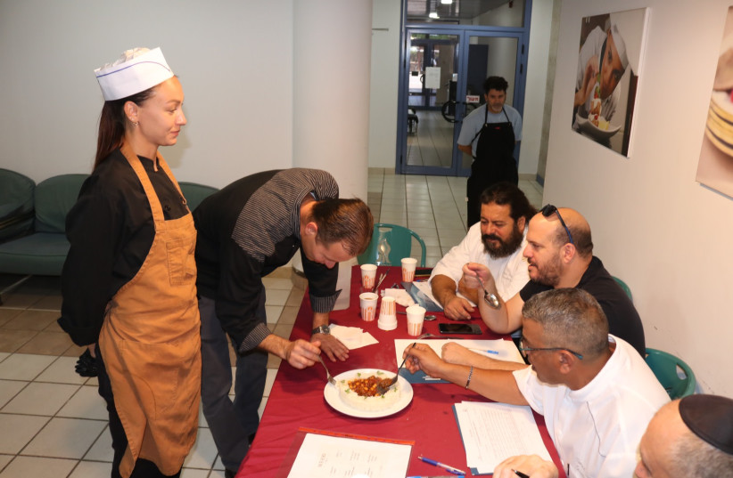 udges from Fattal Hotels sit around a table as a Masa Israel Journey culinary program participant presents his final dish during the program’s final exams, May 26, Eilat.