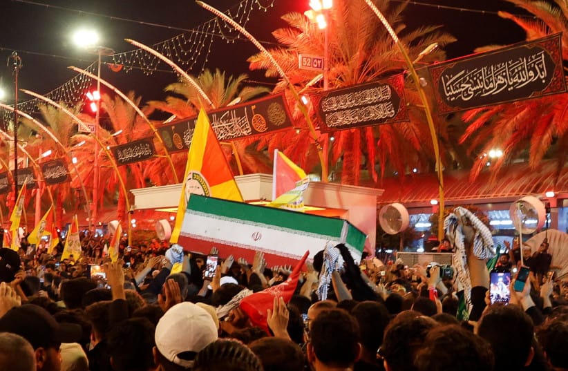 People carry the coffin of Iran's late Supreme Leader Ayatollah Ali Khamenei, who was killed on February 28 in Israeli and US airstrikes, during a funeral procession in Karbala, Iraq, July 9, 2026.