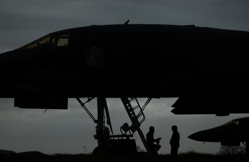 US Airforce (USAF) personnel work by a USAF B-1B bomber, at RAF Fairford airbase, which is used by USAF personnel, amid the US–Israeli conflict with Iran.