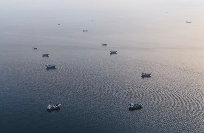 This aerial photograph shows boats anchored off Oman's northern Musandam Peninsula near the Strait of Hormuz on June 27, 2026.