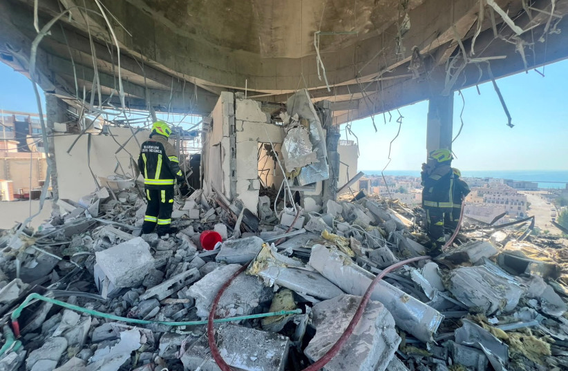 Bahrain civil defence and rescue personnel work in a residential building, which according to the Bahraini Interior Ministry, was hit by an Iranian drone, in Muharraq, Bahrain, June 28, 2026.