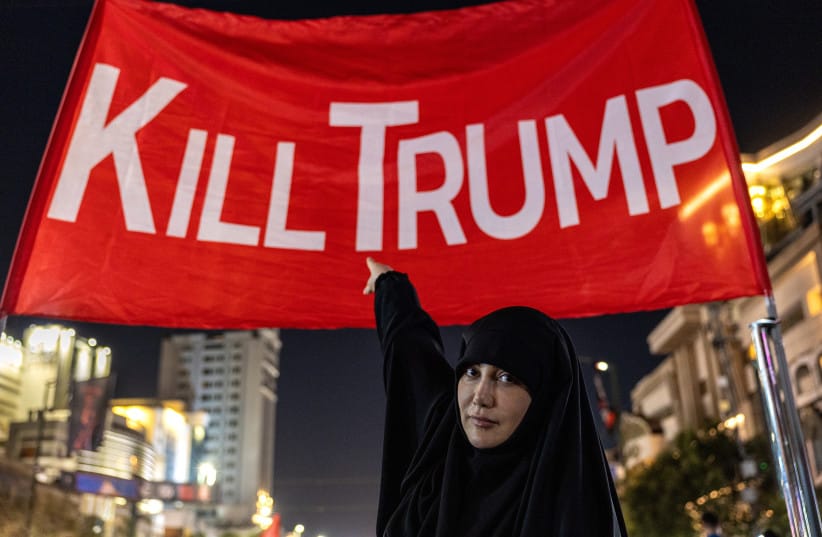 Mourners pose for photos under a ''kill Trump'' banner set up in a main thoroughfare near the Imam Reza Shrine, Mashhad, Iran, July 9, 2026