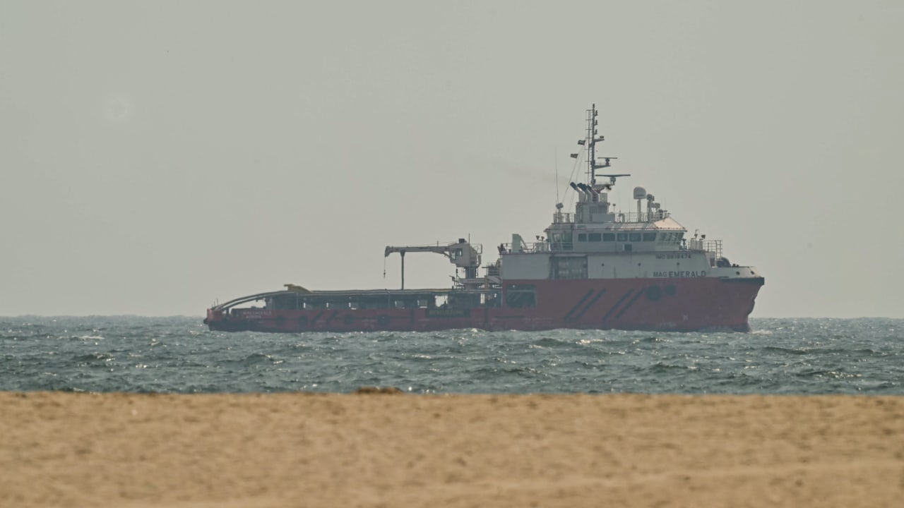 A ship sails off the coast of Ajman on July 10, 2026.