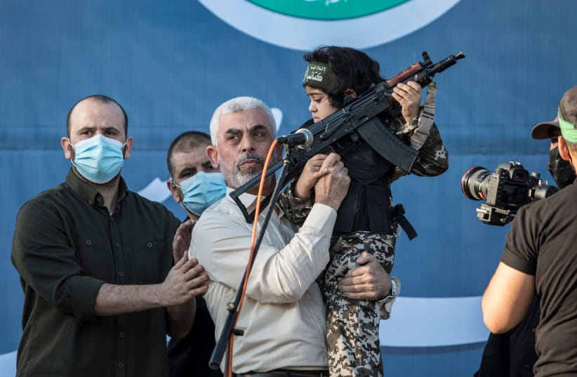 Yahya Sinwar, (C) the elected leader of Hamas appears during a ceremony for fighters killed by Israeli air strikes at Yarmouk football Stadium on May 24,2021 in Gaza City, Gaza.