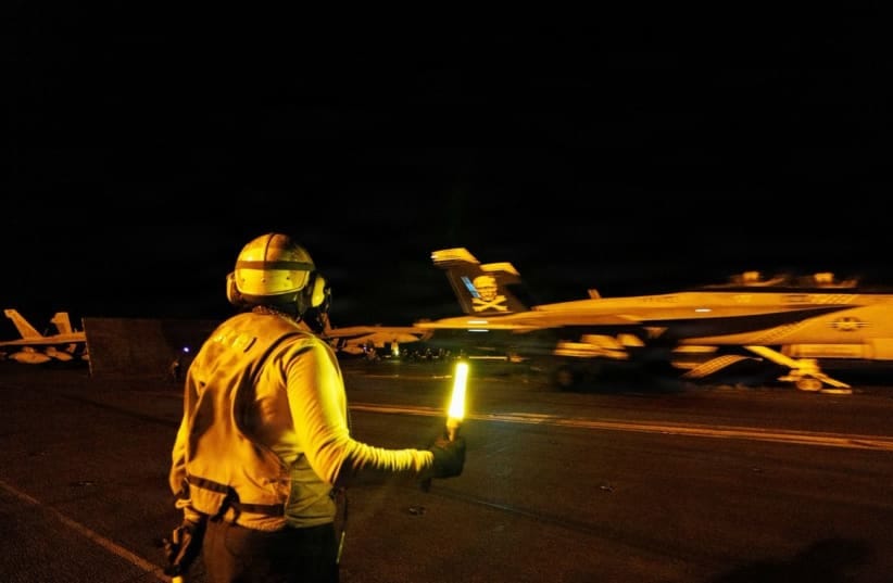 A US Navy fighter jet aboard the top deck of the USS George H.W. Bush in the Arabian Sea, published July 15, 2026; illustrative.