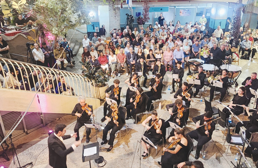 THE JERUSALEM STREET ORCHESTRA received payment for its performance at the Clal Building with the help of the Bar-Kayma association.