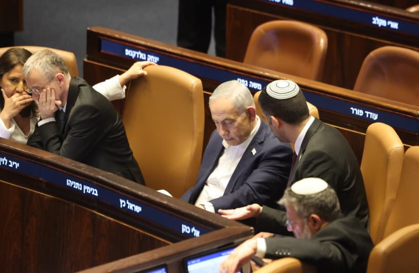 Prime Minister Benjamin Netanyahu and Communications Minister Shlomo Karhi talk amid votes on Karhi's communications bill in the Knesset, Jerusalem, July 16, 2026.