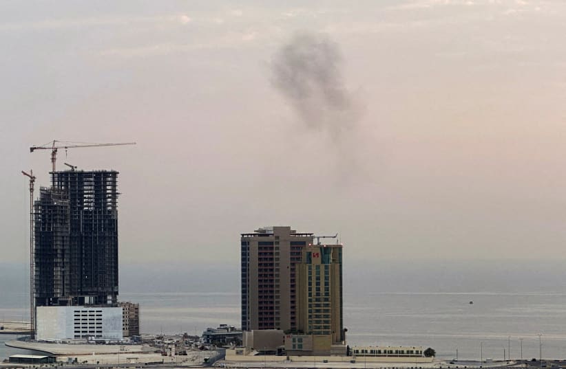 Smoke rises after a drone was intercepted during early morning hours in Manama, Bahrain, July 14, 2026. 