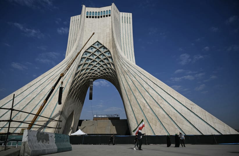 Mourners walk through Tehran's landmark Azadi Square ahead of the funeral procession of Iran's slain supreme leader Ali Khamenei and members of his family on July 6, 2026; Illustrative.
