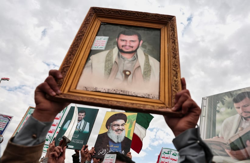 Houthi supporters hold up posters of Houthi leader, Abdul-Malik al-Houthi and the late leader of Lebanon's Hezbollah, Hassan Nasrallah, during a demonstration in Sanaa, Yemen, to show solidarity with Lebanon, after a 10-day ceasefire between Lebanon and Israel went into effect, April 17, 2026.