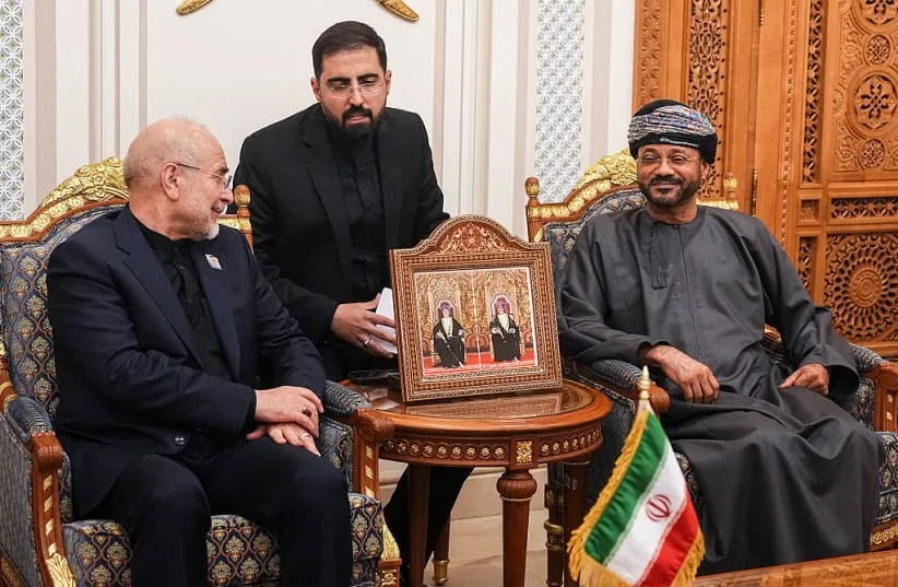 Iranian parliament speaker Mohammad Bagher Ghalibaf (L) speaks with Omani Foreign Minister Badr bin Hamad Al Busaidi (R) during a meeting in Muscat, Oman, on June 22, 2026. (credit: Hamed Malekpour / Middle East Images / AFP via Getty Images)
