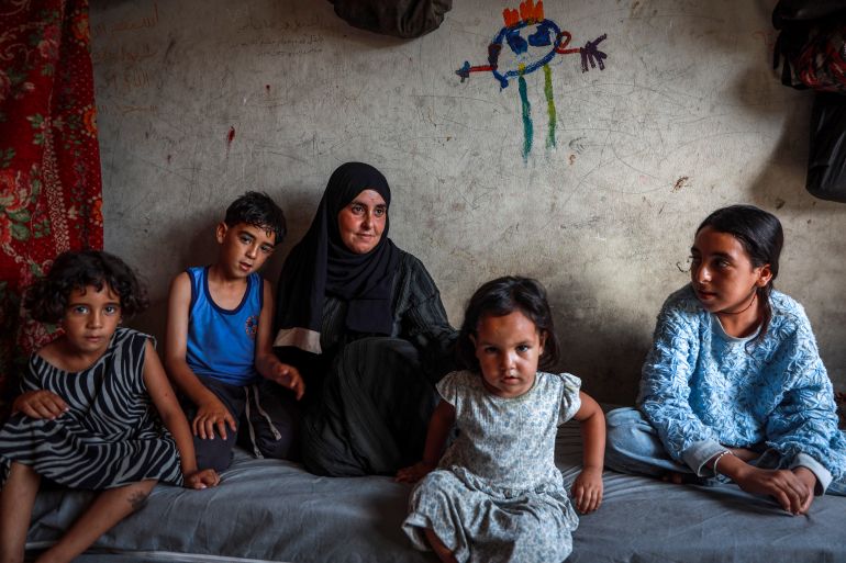 Faten Nabhan with her children,Salsabeel, 14; Mohammed, 12; Tala, 6; and Alfat, 3, who lost their father during the war on Gaza.