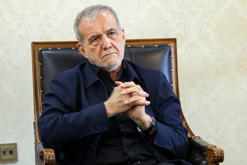 Iranian President Masoud Pezeshkian delivers a speech.