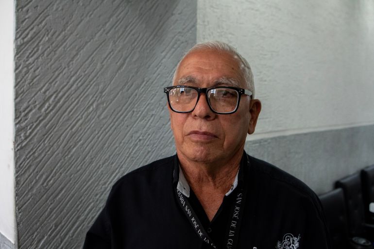 Santiago Rodriguez works at the funeral home in La Guaira
