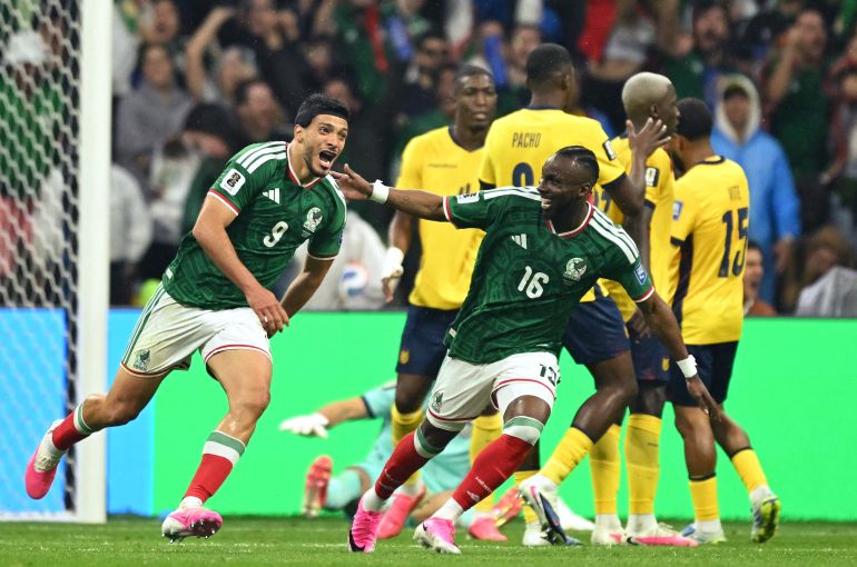 Mexico's Raul Jimenez celebrates scoring his team's second goal with Julian Quinones (Yuri Cortez/AFP)