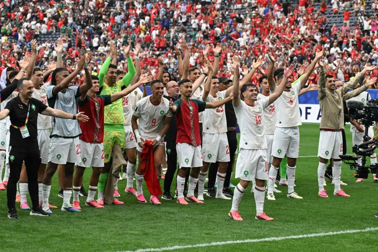 Morocco's forward #10 Brahim Diaz and teammates celebrate after winning the 2026 World Cup round of 16 football match between Canada and Morocco at the Houston Stadium in Houston on July 4, 2026. (Photo by RONALDO SCHEMIDT / AFP)
