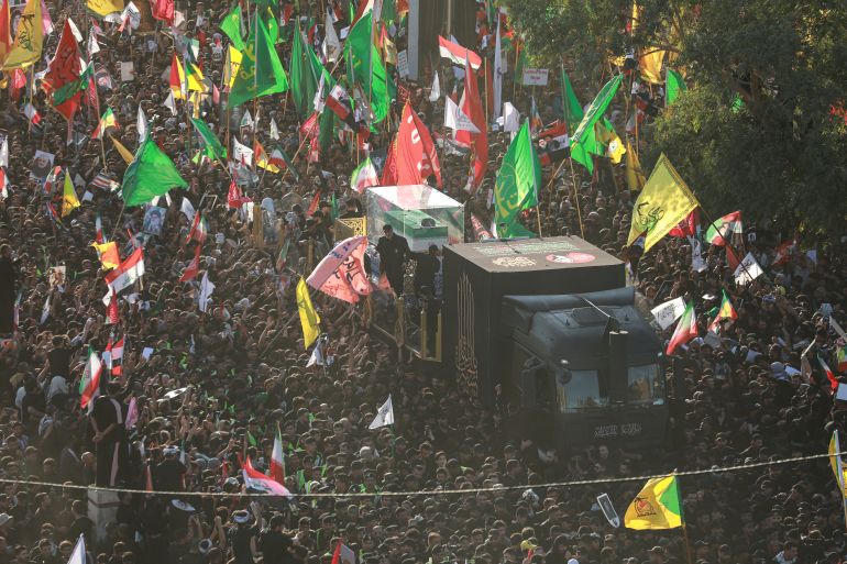 Crowds of mourners surround the convoy carrying the coffin of Iran's slain Supreme Leader Ali Khamenei during a funeral procession in Najaf, Iraq on July 8, 2026.