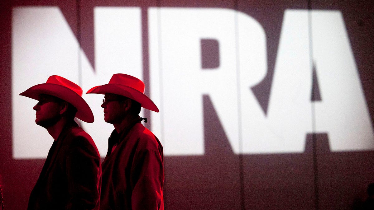 FILE - In this May 4, 2013, file photo, National Rifle Association members listen to speakers during the NRA's 142 annual Meetings and Exhibits at the George R. Brown Convention Center in Houston. A federal judge on Wednesday, Dec. 11, 2019, blocked enforcement of a Los Angeles law requiring businesses that want city contracts to disclose whether they have ties to the National Rifle Association. (Johnny Hanson/Houston Chronicle via AP, File)