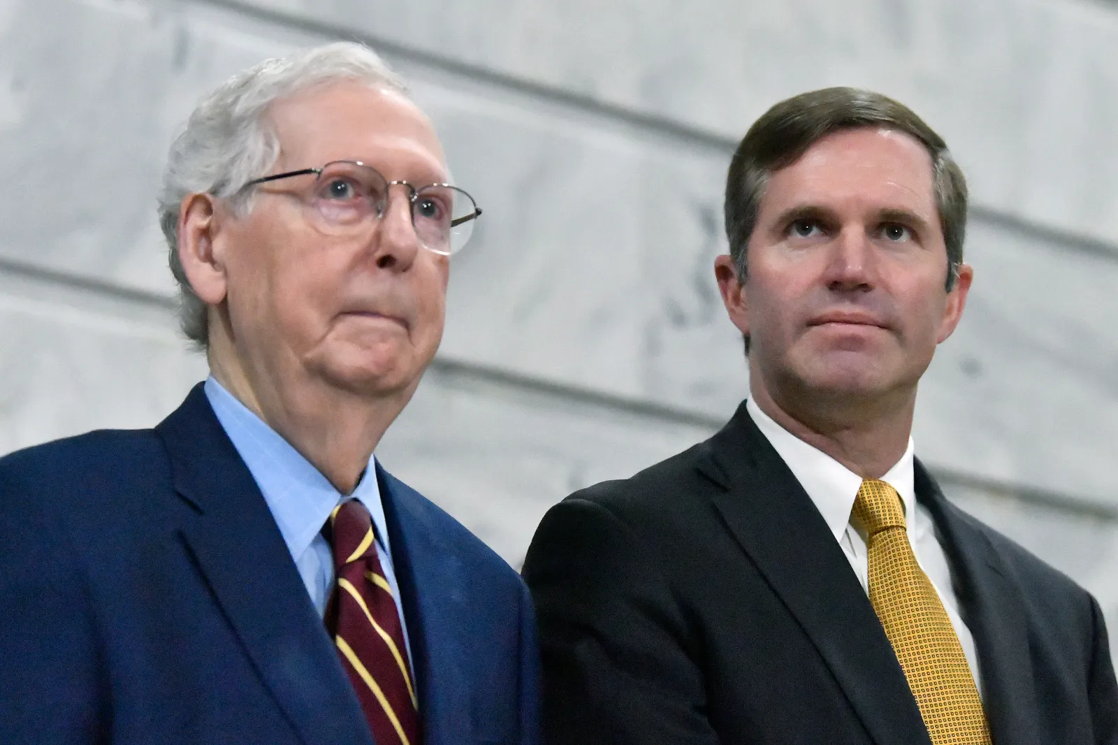 U.S. Senator Mitch McConnell, left, and Kentucky Governor Andy Beshear are pictured during a ceremony in the Rotunda at the Kentucky State Capitol in Frankfort on January 2, 2024.