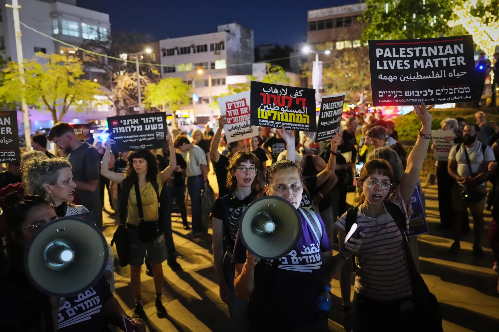 People protest against settlers violence in the West Bank, in Tel Aviv, Israel, Thursday, April 16, 2026. (AP Photo/Ariel Schalit)