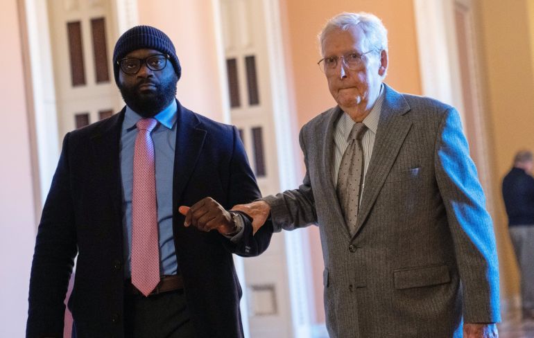 FILE - Sen. Mitch McConnell, R-Ky., right, walks through the Capitol, Jan. 15, 2026, in Washington. (AP Photo/Allison Robbert, File)