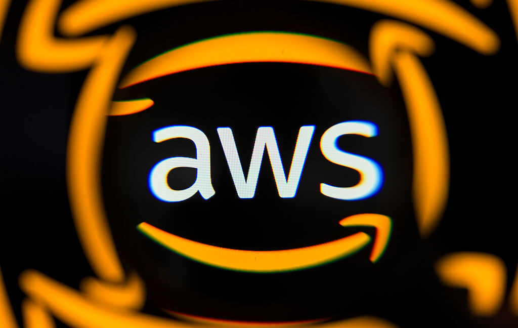 The AWS logo is displayed on a computer screen photographed through a magnifying glass in Creteil, France, on May 4, 2026.