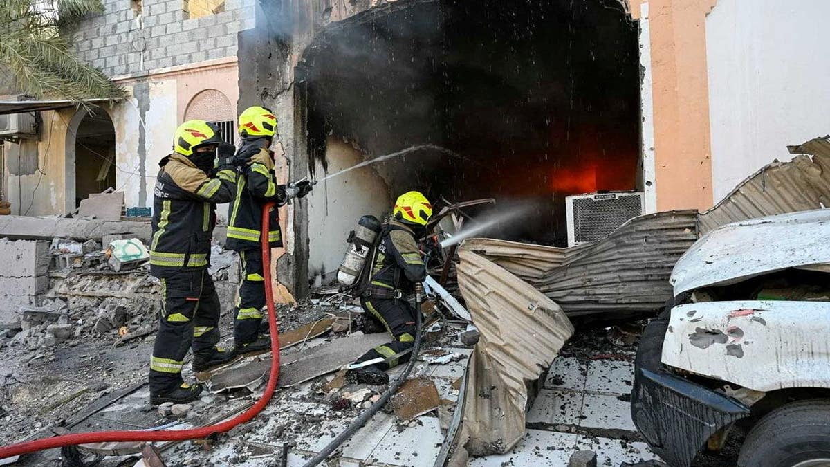 Firefighters work to extinguish fire