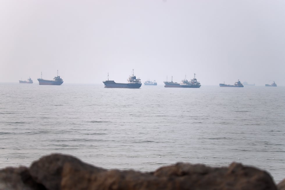 Commercial vessels are seen in the Strait of Hormuz off Bandar Abbas, Iran, Tuesday, June 30,...