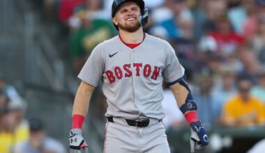Curtis Mead of the Red Sox grimaces after being hit by a pitch during Monday night's game against the Athletics.