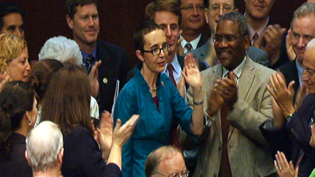 Aug. 1, 2011: In this image from House TV, Rep. Gabrielle Giffords, D-Ariz., appears on the floor of the House for a vote on the plan to raise the federal debt limit.