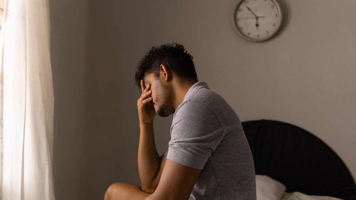 Tired man just woke up. Concept of low energy and sleeplessness. - stock photo