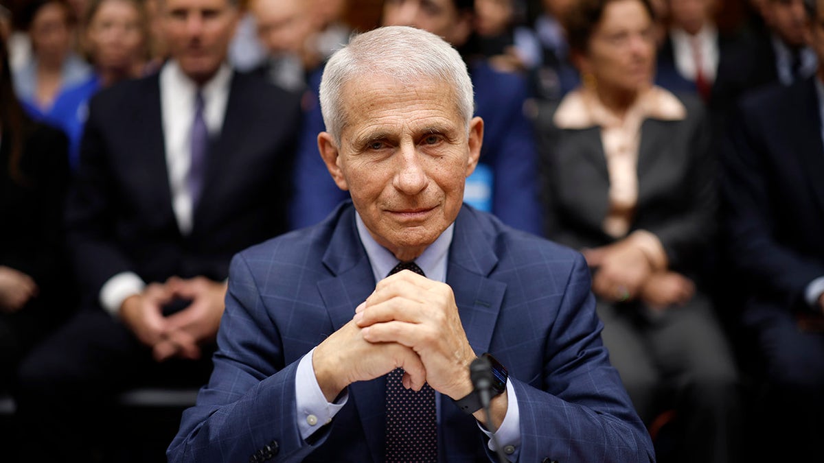 Dr. Anthony Fauci sits at testimony table.