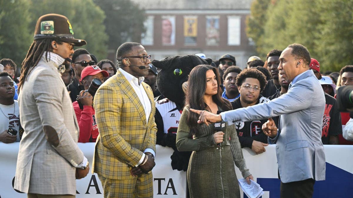 Cam Newton, Shannon Sharpe, Molly Qerim and Stephen A. Smith stand together at ESPN First Take.