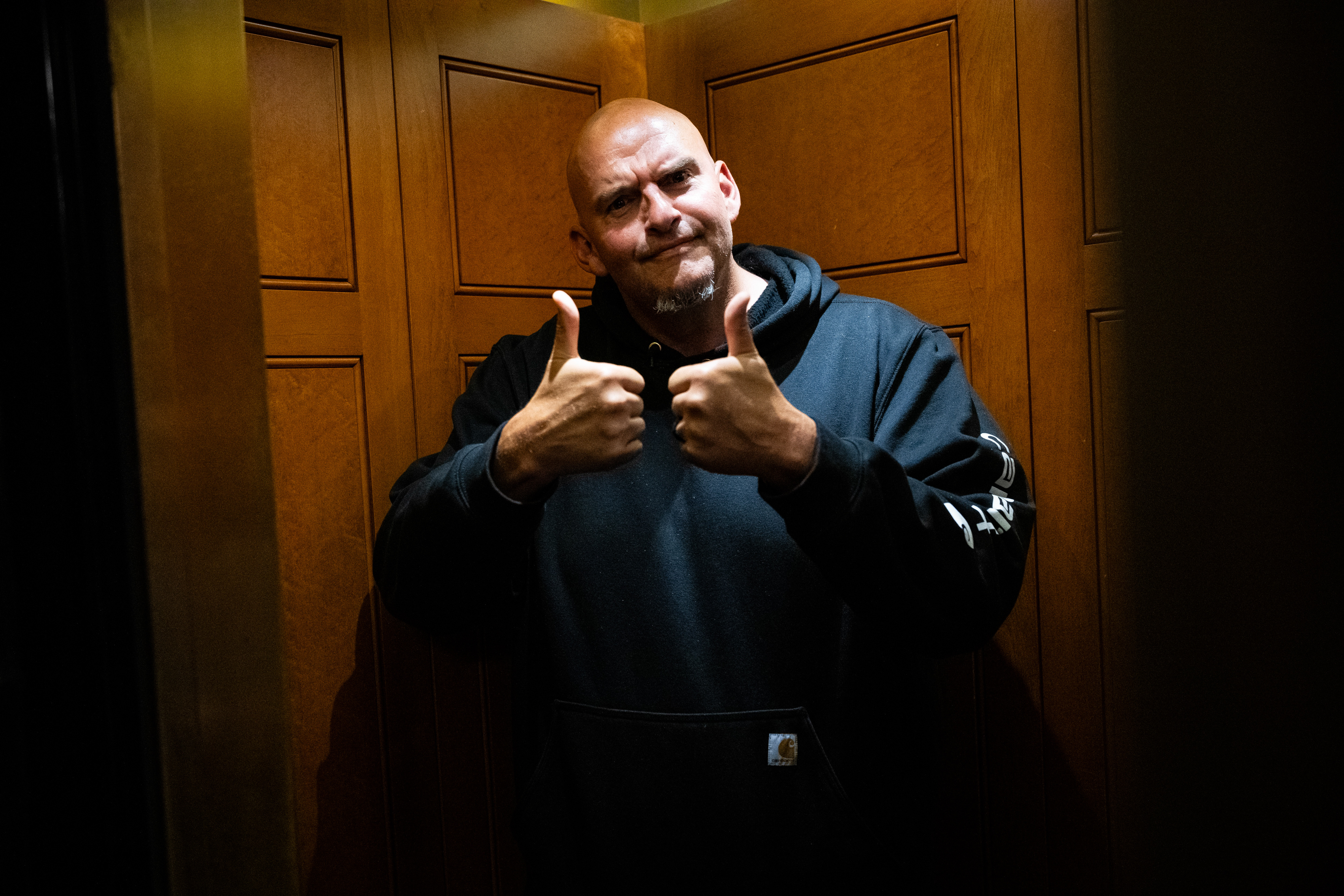 Senator John Fetterman, a Democrat from Pennsylvania, gives thumbs up in an elevator while departing a Senate vote at the US Capitol in Washington, DC, US, on Monday, June 15, 2026. The Senate will vote on an updated version of a bipartisan affordable housing legislative package this week, according to Senate aides, marking the latest step after months of negotiations as lawmakers in the House and Senate pushed competing versions of the bill. Photographer: Graeme Sloan/Bloomberg via Getty Images