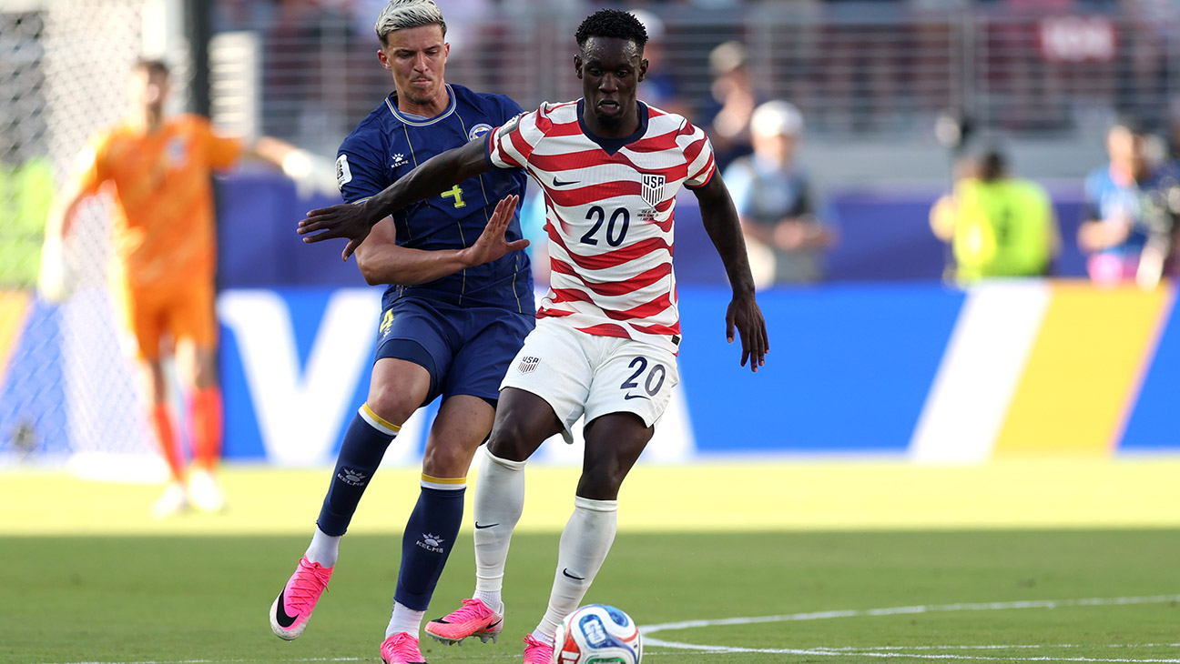Folarin Balogun #20 of the United States is challenged by Tarik Muharemovic #4 of Bosnia and Herzegovina during the FIFA World Cup 2026 Round of 32 match between USA and Bosnia and Herzegovina at San Francisco Bay Area Stadium on July 01, 2026 in Santa Clara, California.
