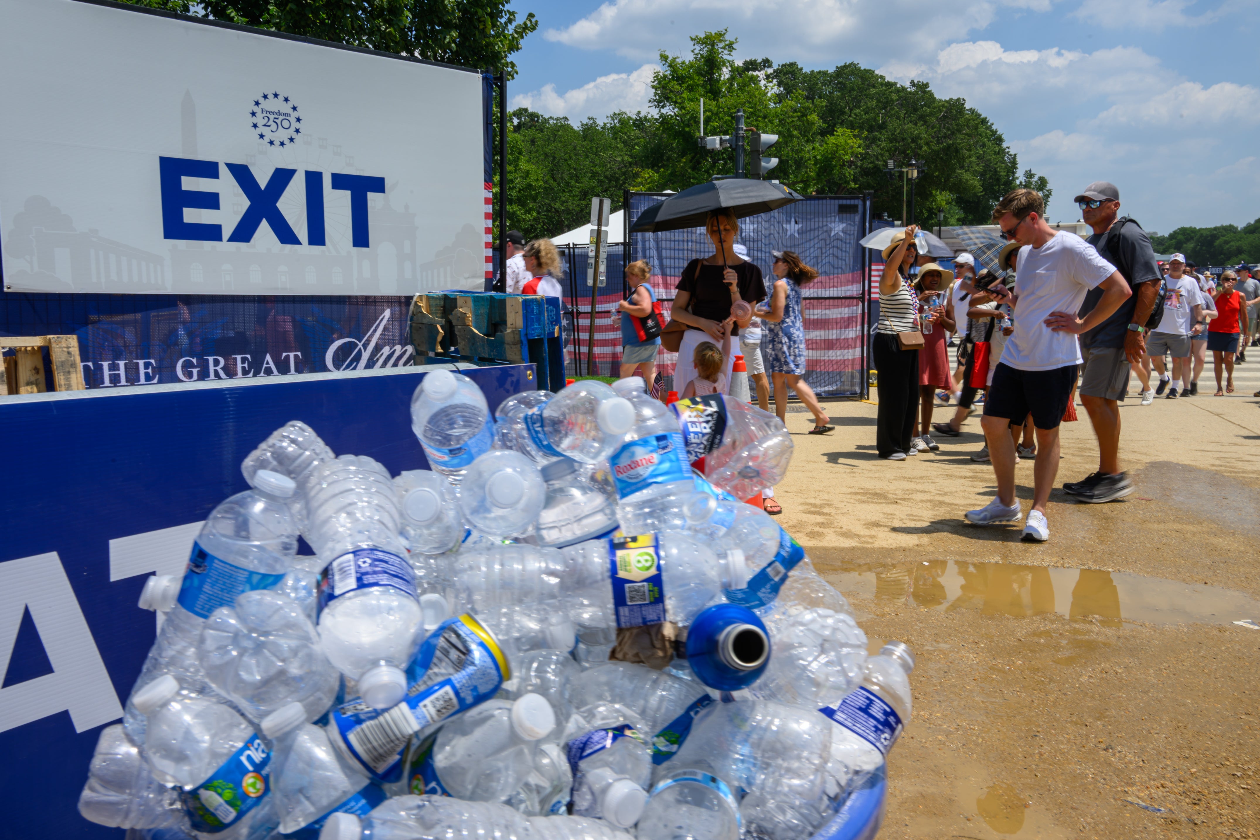 Guests leave the state fair after it was postponed until 5 p.m. ET