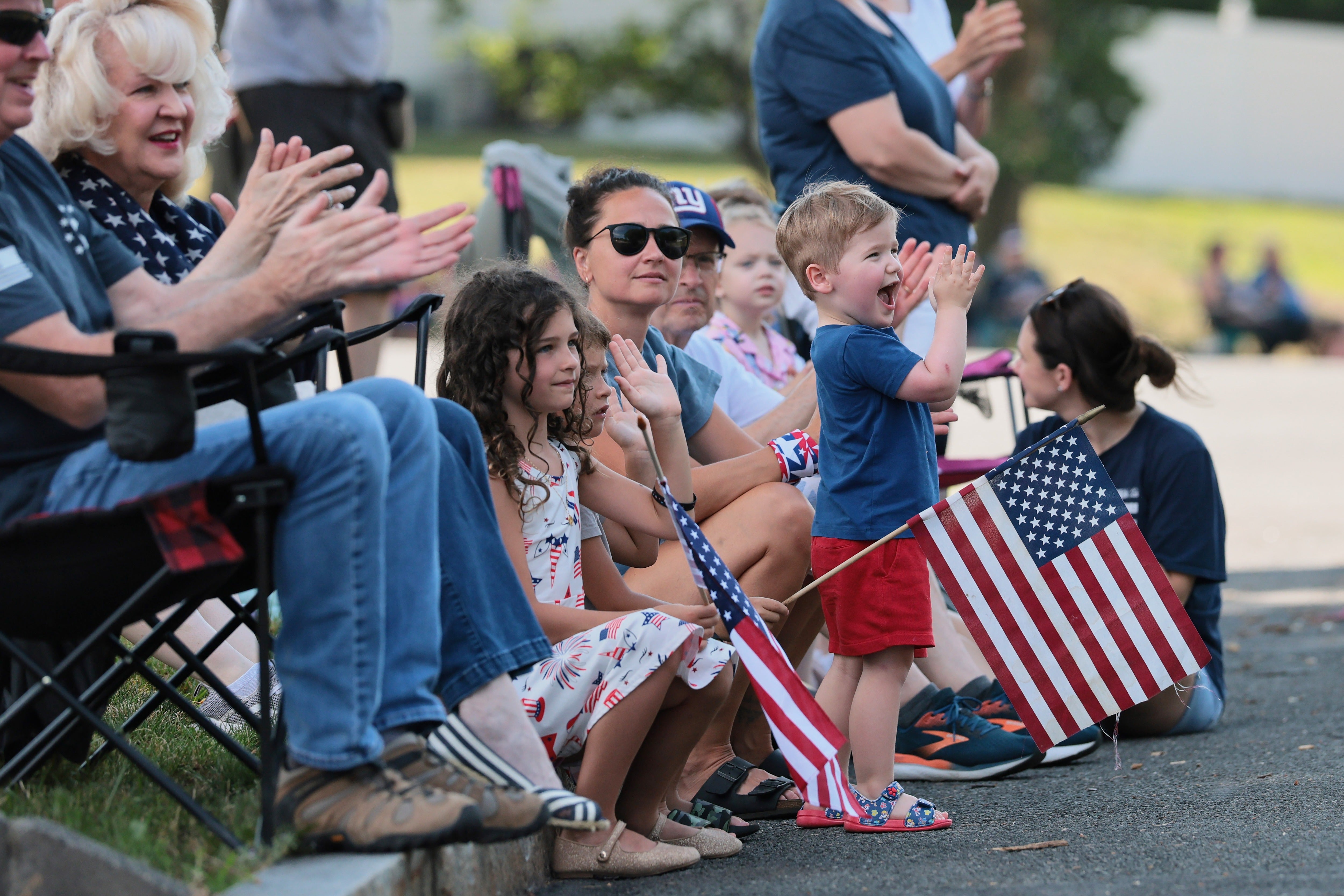 People attend a July Fourth Parade along the Walkway of Heroes and Independence Avenue in Tappan, New York