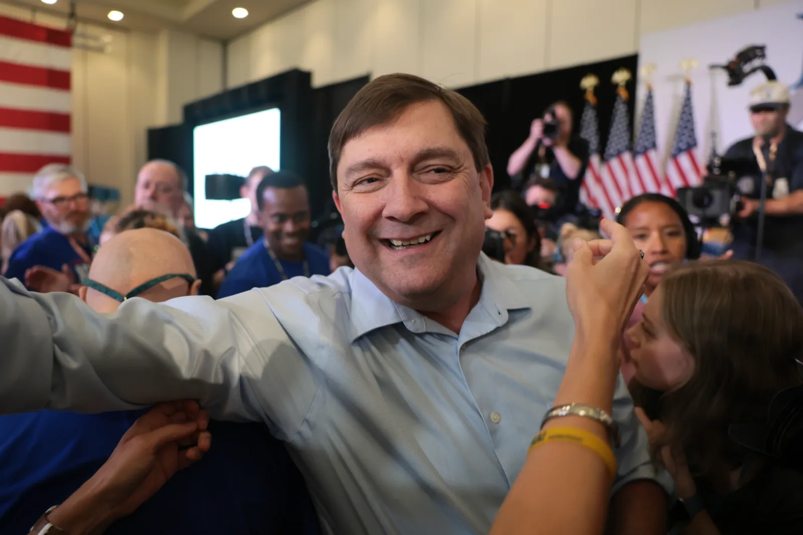 Maine Senate President Troy Jackson greets people during a nominating convention in Bangor, Maine on July 25, 2026.