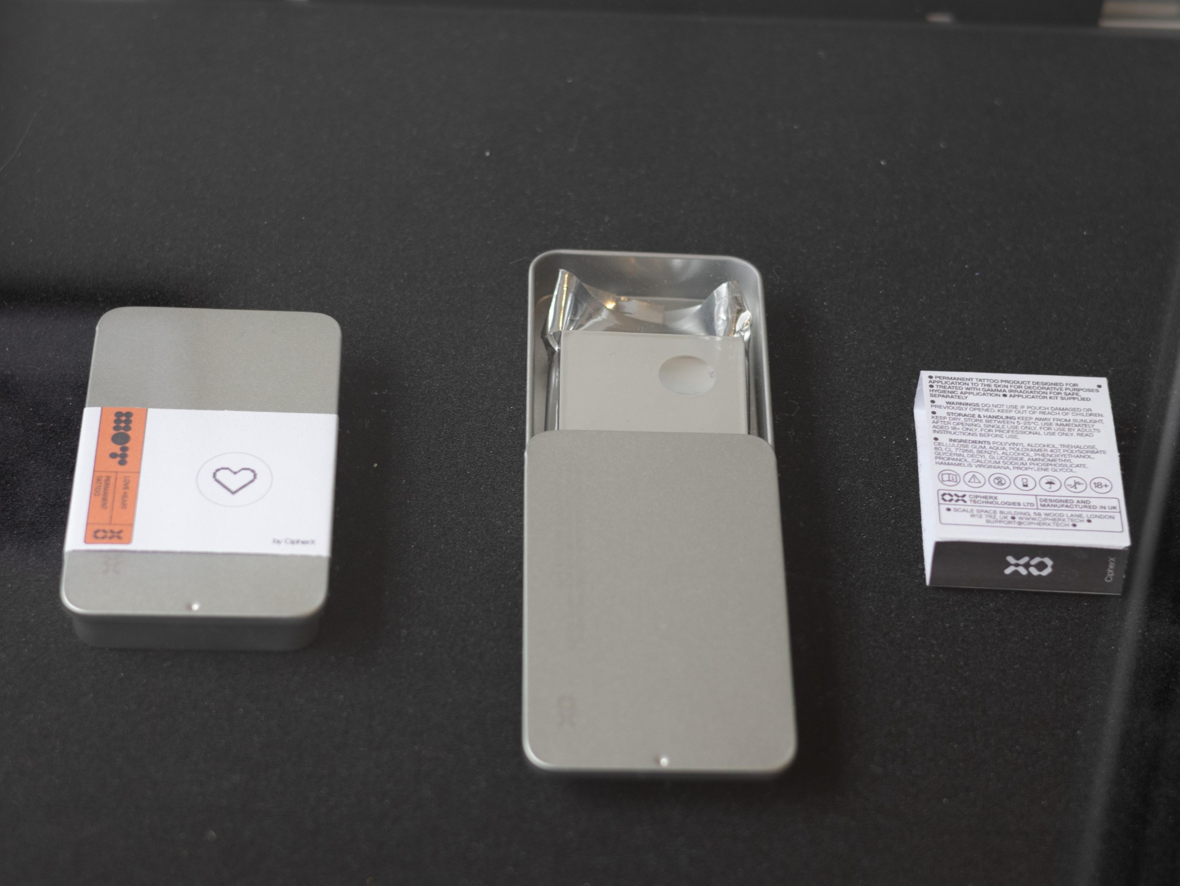A photograph of a prototype DIY Microdot patch tattoo kit that could be mailed to customers.